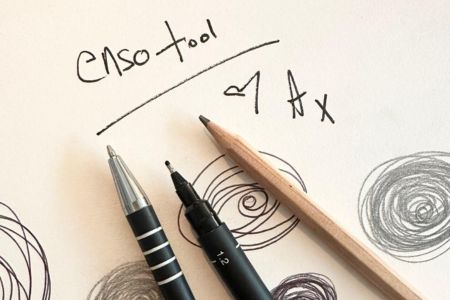 Pens and pencils on a page entitled Enso tool with examples